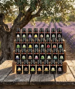 Range of 31 therapeutic grade essential oils on a wooden display stand in Provence | OkO-OkO