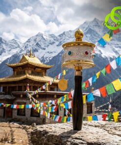 Close-up of a brass moulin priere tibetain mantras with a dark wooden handle against a scenic mountain temple backdrop