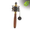Detailed view of a handheld moulin priere tibetain mantras with a wooden handle and engraved metal cylinder with blue gems