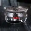 Glazen theepottenwarmer op een tafel | oko oko