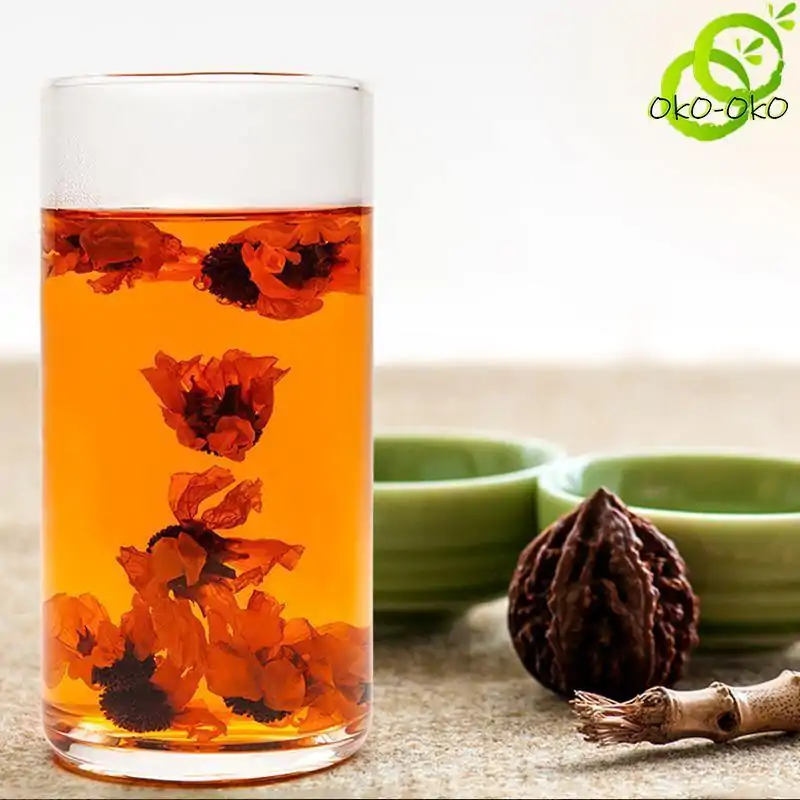 Thé et Infusion <br> Chrysanthème des Neiges. | OkO-OKO™ Thé Chrysanthème des Neiges en infusion dans un verre transparent | OkO-OkO