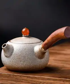 Teekanne-japanisch-keramisch-sandgestrahlt-varianten-weiß-mit-orangem-Deckel-Knopf.jpg