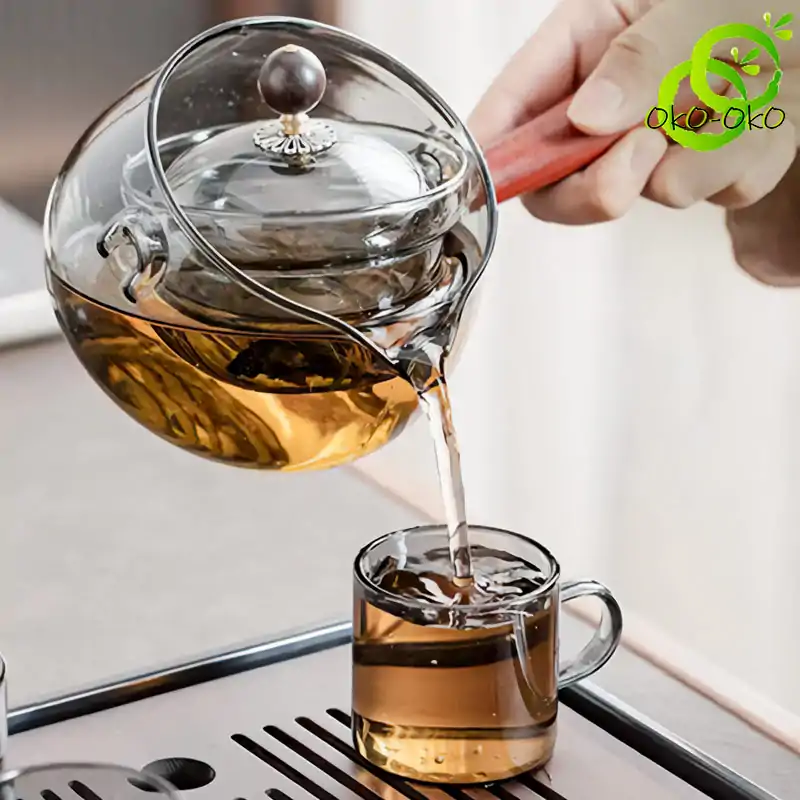 Théière Rotative en Verre 500 ml | OkO-OKO™ Belle Théière rotative en verre transparent pendant le service oko-oko